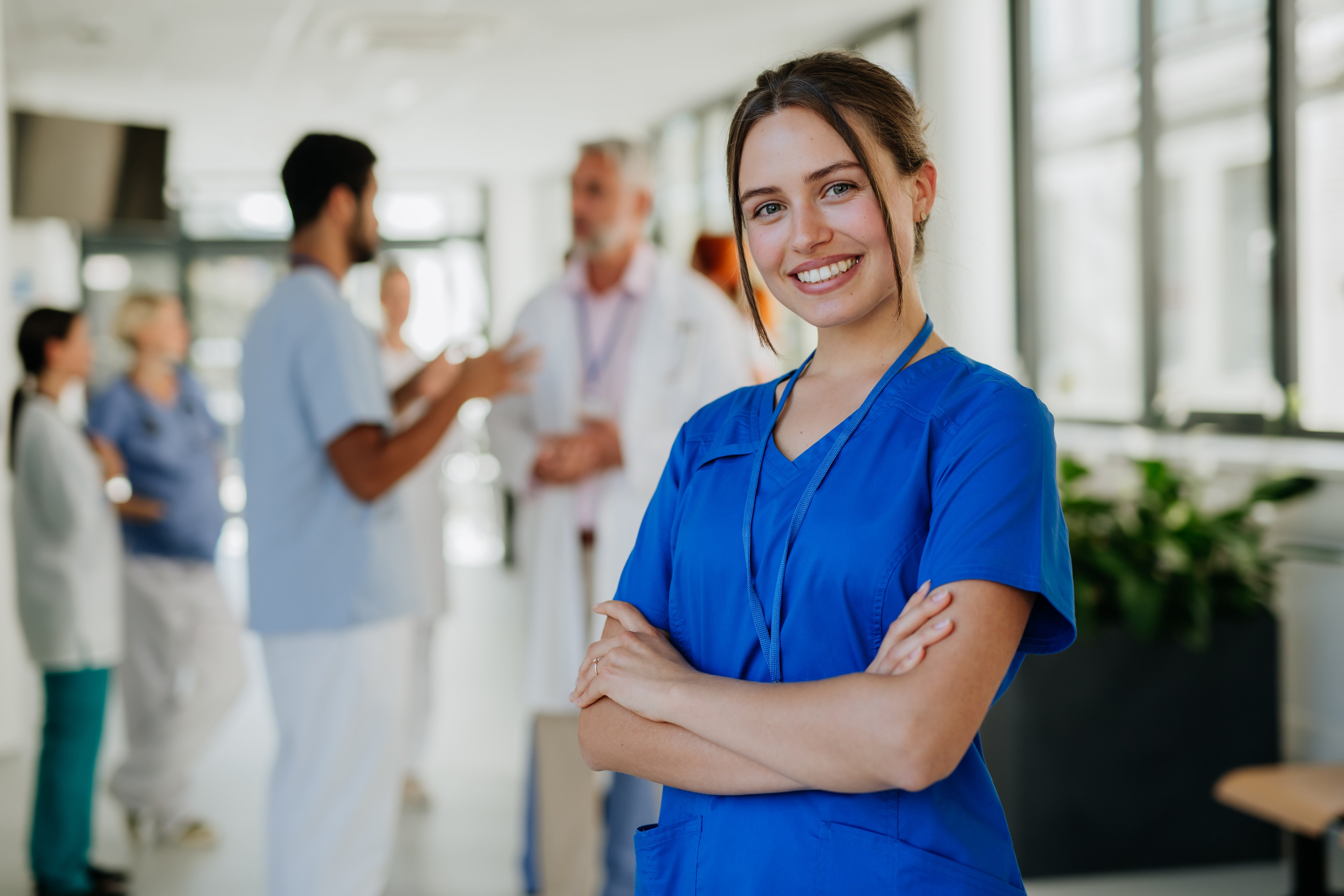 portrait-of-young-woman-nurse-at-hospital-corridor-2022-12-14-04-40-12-utc